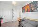 Cozy bedroom showcasing modern decor, movie posters, and a comfortable gray couch, perfect for relaxation at 1150 Buice Lake Pkwy, Acworth, GA 30102