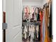 Organized walk-in closet with ample shelving, hanging space, and a variety of clothing at 1150 Buice Lake Pkwy, Acworth, GA 30102
