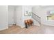 Welcoming entryway featuring a staircase, wood floors, and natural light at 1150 Buice Lake Pkwy, Acworth, GA 30102