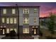Charming townhome displaying a mix of brick and siding exterior at twilight at 1150 Buice Lake Pkwy, Acworth, GA 30102