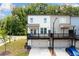 Two-story townhome featuring a drive-under garage and private balcony at 1150 Buice Lake Pkwy, Acworth, GA 30102
