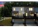 Rear of a two-story townhome with a drive-under garage and balcony at 1150 Buice Lake Pkwy, Acworth, GA 30102
