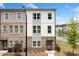 Two-story townhome with a mix of brick and siding and manicured landscaping at 1150 Buice Lake Pkwy, Acworth, GA 30102