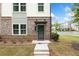 Charming two-story townhome featuring a mix of brick and siding facade at 1150 Buice Lake Pkwy, Acworth, GA 30102