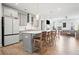 Bright, open kitchen with gray cabinets, stainless steel appliances, and a large island with bar seating at 1150 Buice Lake Pkwy, Acworth, GA 30102