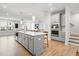 Spacious kitchen with an island, stainless appliances and view to the stairs and living area at 1150 Buice Lake Pkwy, Acworth, GA 30102