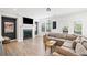 Comfortable living room with a fireplace, large windows, and a neutral color scheme at 1150 Buice Lake Pkwy, Acworth, GA 30102