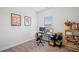 Home office with ample natural light, a comfortable chair, and a functional workspace at 1150 Buice Lake Pkwy, Acworth, GA 30102