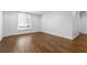 Bright bedroom with hardwood floors, neutral walls, and window with blinds at 1421 Peachtree Ne St # 310, Atlanta, GA 30309