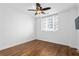 Clean bedroom with hardwood floors, white walls, ceiling fan, and bright natural light at 1421 Peachtree Ne St # 310, Atlanta, GA 30309