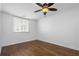 A cozy bedroom with hardwood floors and natural light from the window at 1421 Peachtree Ne St # 310, Atlanta, GA 30309