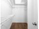 A walk-in closet featuring hardwood floors and white wire shelving at 1421 Peachtree Ne St # 310, Atlanta, GA 30309