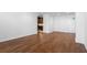 Open floor plan living room with hardwood floors flowing into an efficient kitchen at 1421 Peachtree Ne St # 310, Atlanta, GA 30309