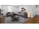 Cozy living room with hardwood floors, grey sofa, and stylish decor at 1421 Peachtree Ne St # 310, Atlanta, GA 30309