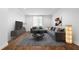 Stylish living room with hardwood floors, gray sectional sofa, area rug, and natural light at 1421 Peachtree Ne St # 310, Atlanta, GA 30309