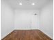 Empty living room with hardwood floors, white walls and ceiling at 1421 Peachtree Ne St # 310, Atlanta, GA 30309