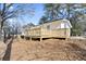 An outdoor deck surrounded by a spacious backyard, offering an outdoor relaxing and recreational space at 1084 Fairburn Nw Rd, Atlanta, GA 30331
