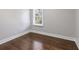 Cozy bedroom featuring hardwood floors, neutral walls and natural light at 1084 Fairburn Nw Rd, Atlanta, GA 30331