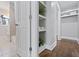 Well-organized closet with built-in shelves, and tile floors at 1084 Fairburn Nw Rd, Atlanta, GA 30331