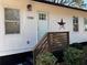 Charming home entrance showcasing a decorative door and well-manicured landscaping at 1084 Fairburn Nw Rd, Atlanta, GA 30331