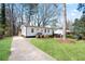 Quaint one-story home with a neatly landscaped yard and a welcoming driveway at 1084 Fairburn Nw Rd, Atlanta, GA 30331