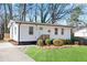 Charming single-story home with a landscaped front yard, complemented by a quaint entrance and fresh exterior at 1084 Fairburn Nw Rd, Atlanta, GA 30331