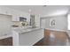 Modern kitchen with white cabinetry, granite countertops, and an island with a sink at 1084 Fairburn Nw Rd, Atlanta, GA 30331