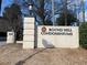 Community sign for Round Hill Condominiums with address number at 5400 Roswell Rd # K1, Atlanta, GA 30342