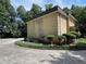 Rear exterior view of the condominium building with well-maintained landscaping at 5400 Roswell Rd # K1, Atlanta, GA 30342