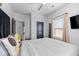 Bright bedroom with a large window, ceiling fan, and stylish decor at 160 A Vanira Se Ave, Atlanta, GA 30315