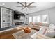 Cozy living room featuring a stone fireplace, hardwood floors, and ample natural light at 160 A Vanira Se Ave, Atlanta, GA 30315