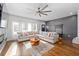 Bright and airy living room with hardwood floors, a comfortable sectional, and modern accents at 160 A Vanira Se Ave, Atlanta, GA 30315