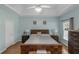 Comfortable bedroom with wood floors, neutral colors, and ample natural light at 1605 Little Lisa Ln, Snellville, GA 30078