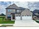 Beautiful two-story home with a two-car garage, brick accents, and a well-manicured lawn at 4190 Hosch Reserve Dr, Buford, GA 30519