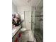 Contemporary bathroom with granite countertops, sleek fixtures, and a modern glass-enclosed shower at 1771 Kristi Dr, Lawrenceville, GA 30043
