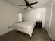 Minimalist bedroom with hardwood floors, a simple bed, and ample closet space, promoting relaxation at 1771 Kristi Dr, Lawrenceville, GA 30043