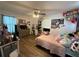 Bright bedroom with a ceiling fan, large window, and cozy decor, creating a welcoming atmosphere at 1771 Kristi Dr, Lawrenceville, GA 30043