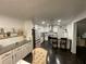 Well-appointed kitchen featuring white cabinets, stainless steel appliances, a breakfast bar, and ample counter space at 1771 Kristi Dr, Lawrenceville, GA 30043