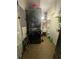 Functional laundry room with stacked washer and dryer, storage cabinets, and ample counter space at 1771 Kristi Dr, Lawrenceville, GA 30043