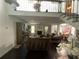 Open-concept living area with high ceilings, dark hardwood floors, and a view into the adjacent dining area at 1771 Kristi Dr, Lawrenceville, GA 30043