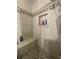 Elegant shower showcasing a built-in seat, niche, and decorative tile accents for a spa-like experience at 1771 Kristi Dr, Lawrenceville, GA 30043