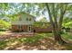 Large backyard featuring a spacious lawn, trees and a two story home at 1831 Galilee Ct, Tucker, GA 30084