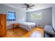 Bedroom with hardwood floors and natural light featuring a ceiling fan at 1831 Galilee Ct, Tucker, GA 30084