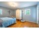 Cozy bedroom featuring hardwood floors, a closet, and a window allowing natural light at 1831 Galilee Ct, Tucker, GA 30084