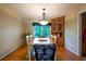 Cozy dining room with hardwood floors, built-in cabinets, and a large window at 1831 Galilee Ct, Tucker, GA 30084