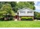 Charming two-story home with a brick facade, well-manicured lawn, and mature trees at 1831 Galilee Ct, Tucker, GA 30084