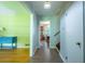 Bright hallway showcasing views into the living spaces, hardwood floors, and lots of natural light at 1831 Galilee Ct, Tucker, GA 30084