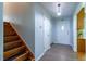 Entryway featuring a staircase, storage cabinets, and laminate floors leading to the living spaces at 1831 Galilee Ct, Tucker, GA 30084