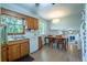Well-maintained kitchen featuring classic wood cabinets and a view into an airy dining area at 1831 Galilee Ct, Tucker, GA 30084