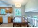 Bright, spacious kitchen with hardwood table and view of the living area at 1831 Galilee Ct, Tucker, GA 30084